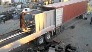 loading metal scrap in containers with machine video [upl. by Calendra337]